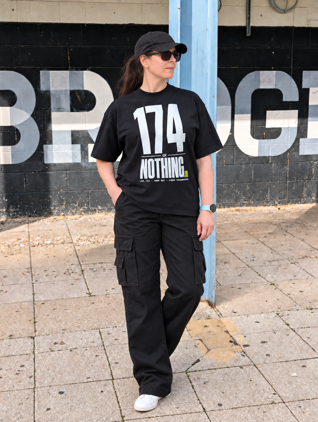 174 Or Nothing Oversized Tee worn with black cargo trousers